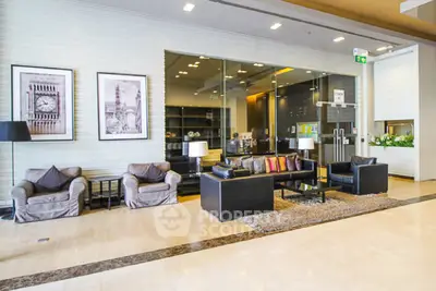 Luxurious modern lobby with stylish seating and elegant decor in a high-end building.