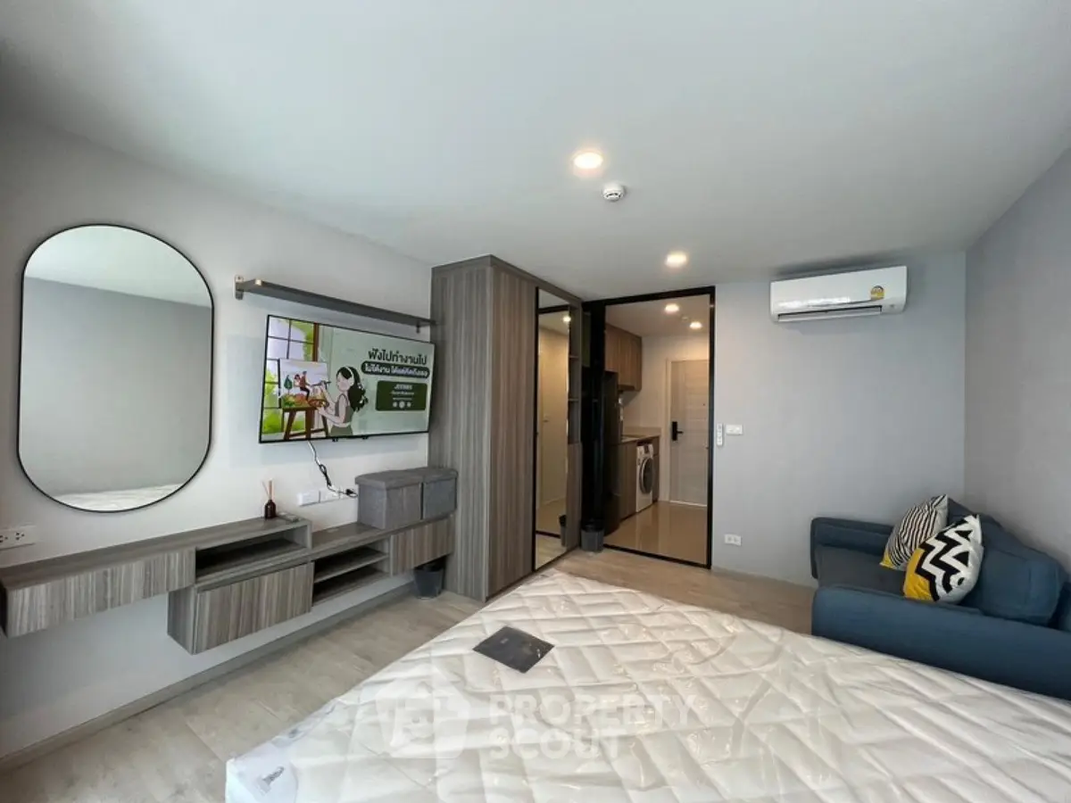 Modern bedroom with stylish decor and open layout in a contemporary apartment.