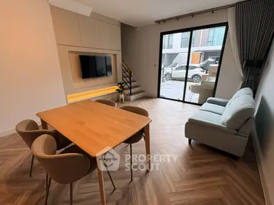 Modern living room with stylish furniture and large window view