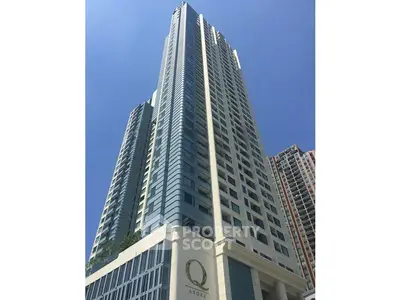 Stunning high-rise building with modern architecture and sleek design in urban setting.