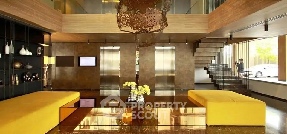 Luxurious modern building lobby with stylish decor and elevators