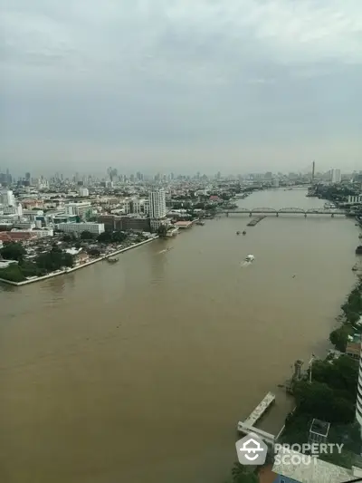 Stunning river view from high-rise building in bustling cityscape