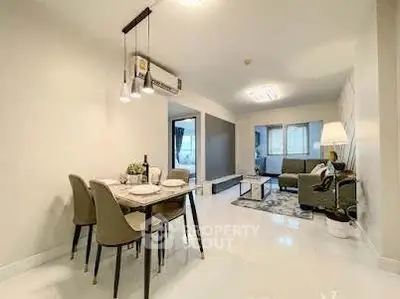 Spacious modern living room with elegant dining area and stylish decor