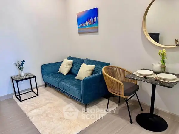 Chic modern living room with blue sofa and stylish decor