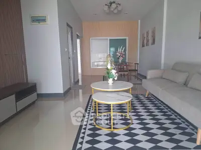 Modern living room with stylish decor and geometric rug