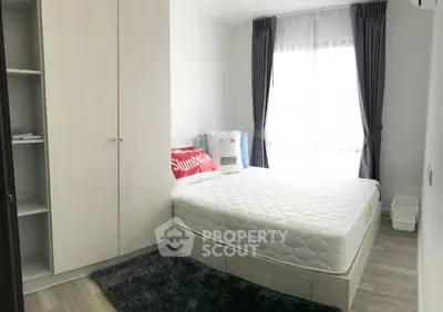 Cozy bedroom with modern furnishings and natural light