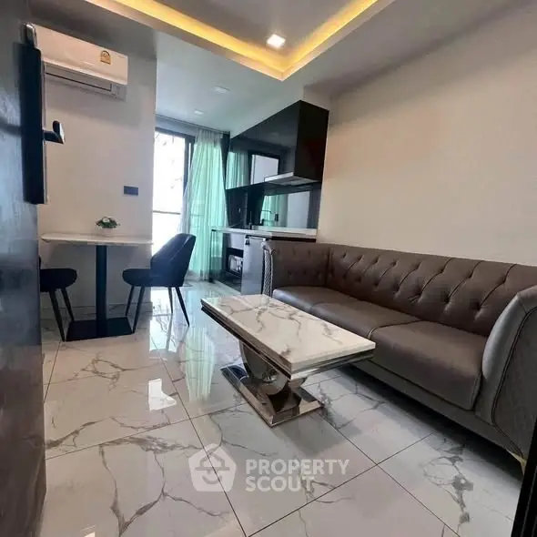 Modern living room with marble flooring and stylish furniture in a contemporary apartment.