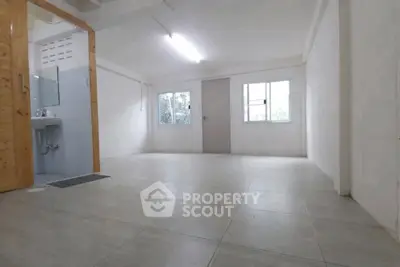 Spacious unfurnished room with tiled flooring and natural light