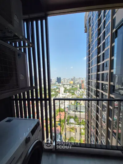 Stunning high-rise balcony view with cityscape and modern building design.