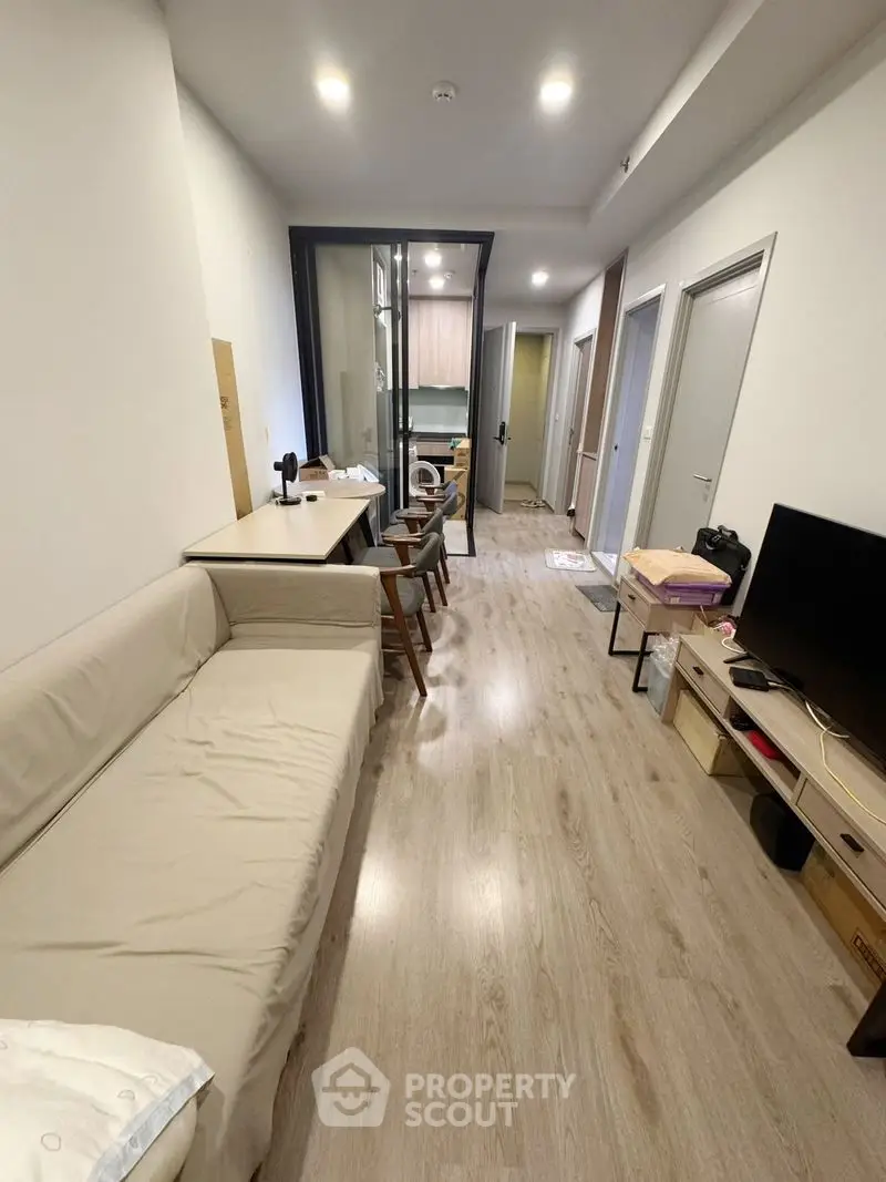 Modern apartment interior with cozy living area and stylish kitchen