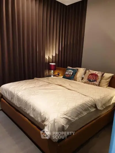 Cozy bedroom with elegant lighting and stylish decor, perfect for relaxation and comfort.