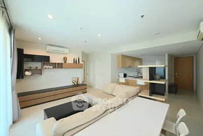 Spacious modern living room with open kitchen and stylish decor