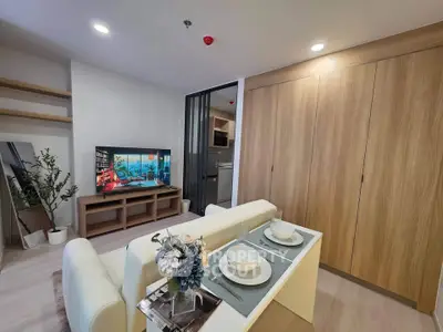 Modern living room with stylish decor and open layout, featuring a cozy dining area and sleek entertainment center.