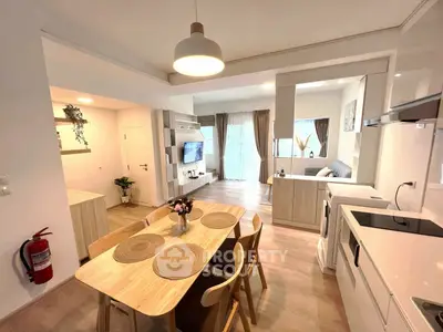 Modern open-plan living and dining area with stylish decor and natural light