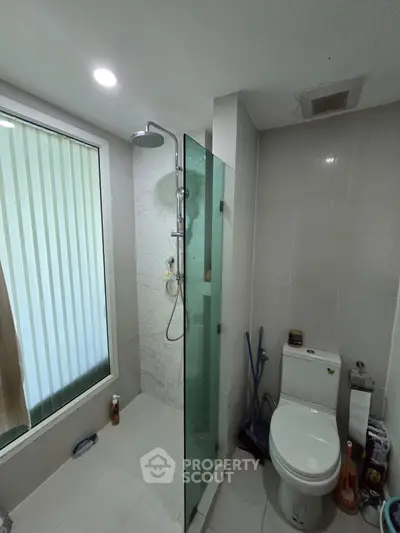 Modern bathroom with glass shower and sleek fixtures