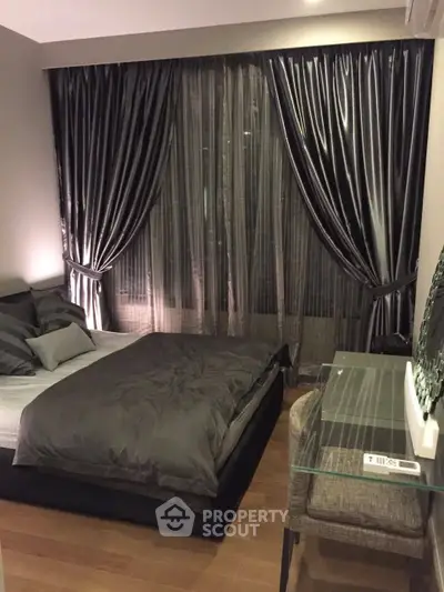 Luxurious bedroom with elegant dark curtains and modern decor