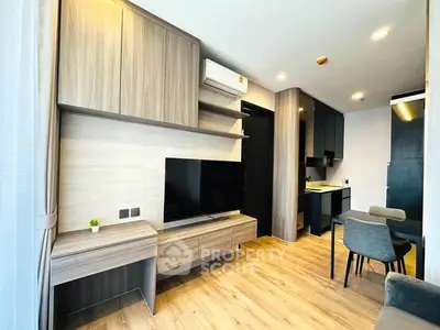Modern living room with wooden flooring and stylish furniture in a cozy apartment.