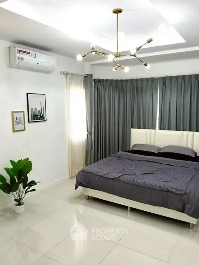 Modern bedroom with elegant lighting and stylish decor