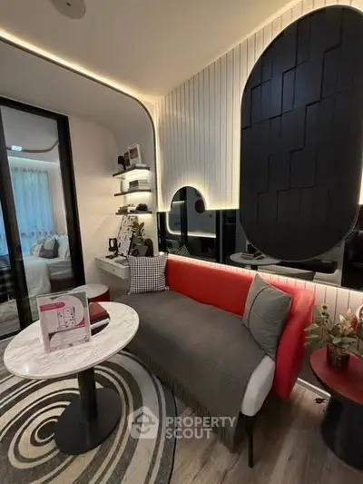 Stylish modern living room with unique wall design and cozy seating area