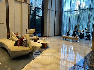 Luxurious modern living room with elegant furniture and floor-to-ceiling windows