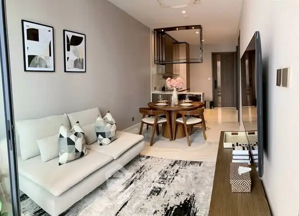 Modern living room with stylish decor and open kitchen layout