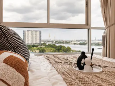 Luxurious bedroom with stunning river view and modern decor