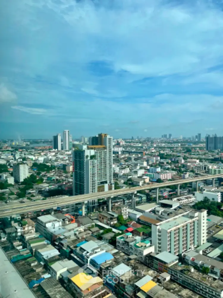 Stunning cityscape view from high-rise building showcasing urban skyline and infrastructure.