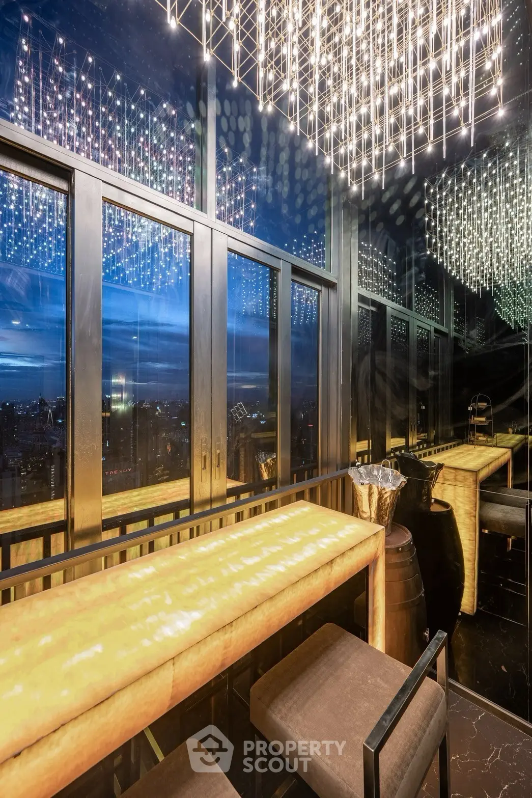 Luxurious rooftop bar with stunning city view and modern lighting design.