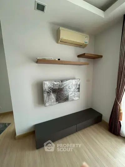 Modern living room with air conditioning and mounted TV setup