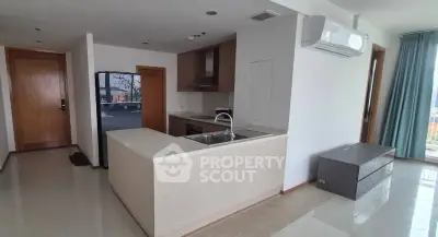 Modern open-layout kitchen with sleek appliances and ample natural light