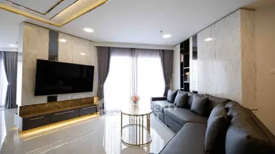 Luxurious modern living room with sleek design and large TV