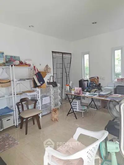 Cozy home office with natural light and organized shelving