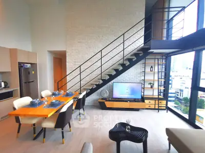 Modern loft apartment with stylish dining area and large windows