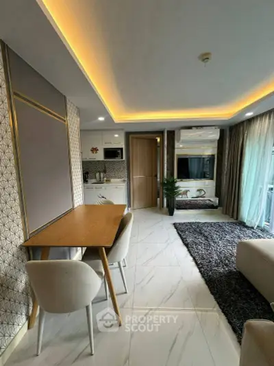 Modern living room with stylish decor and open kitchen layout