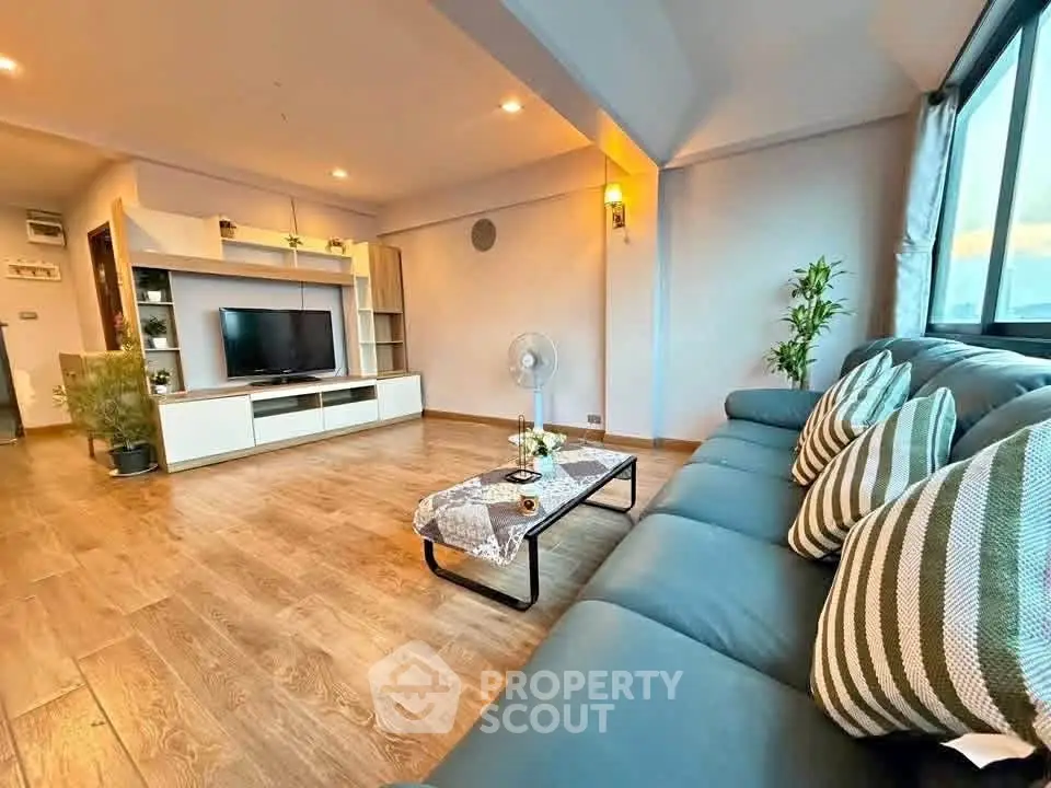 Spacious modern living room with stylish decor and large sofa