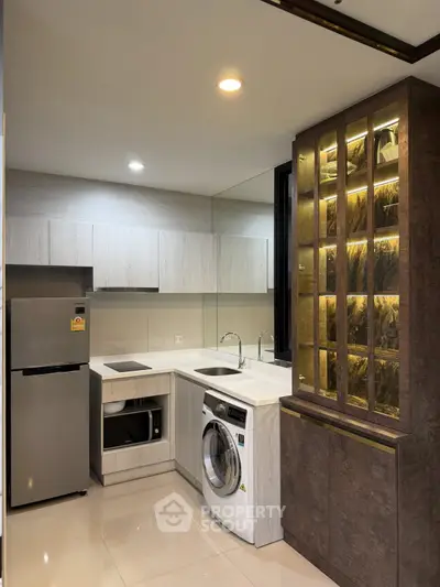 Modern kitchen with sleek appliances and stylish cabinetry