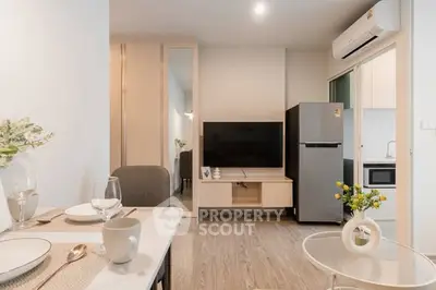 Modern living room with sleek furniture and open kitchen layout