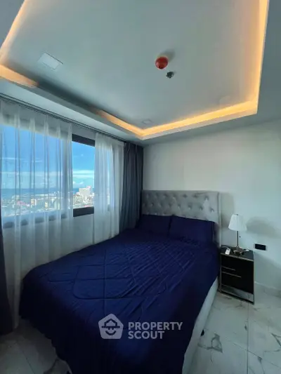 Modern bedroom with city view and elegant lighting