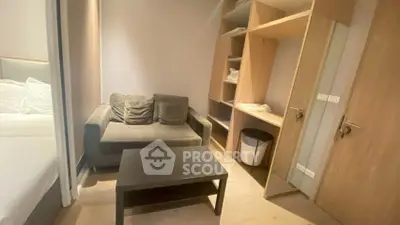Cozy small living area with sofa and storage in modern apartment
