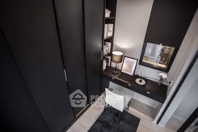 Stylish study nook with modern desk, shelving, and elegant decor in a contemporary home.