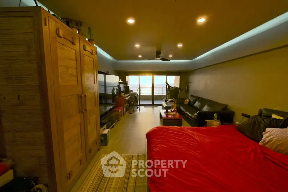 Spacious bedroom with cozy lighting and modern furnishings