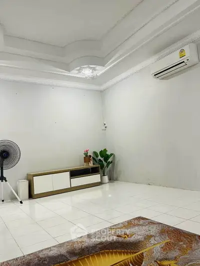Spacious minimalist living room with air conditioning and modern decor