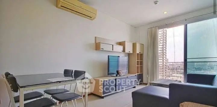 Modern living room with sleek furniture and city view balcony, perfect for urban living.