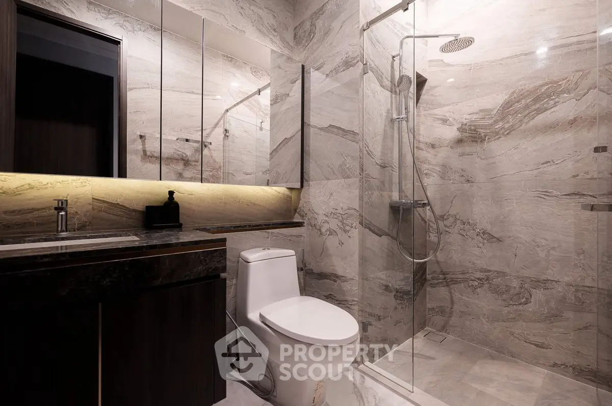 Luxurious modern bathroom with marble walls and sleek fixtures