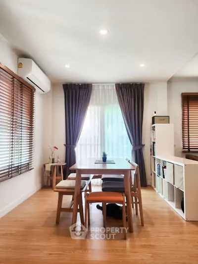 Modern dining area with natural light and stylish decor