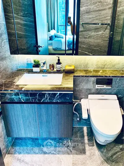 Luxurious modern bathroom with marble finishes and sleek fixtures