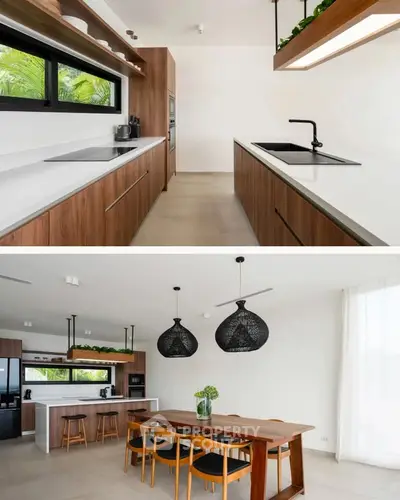 Modern kitchen with sleek wooden cabinetry and open dining area with stylish lighting.