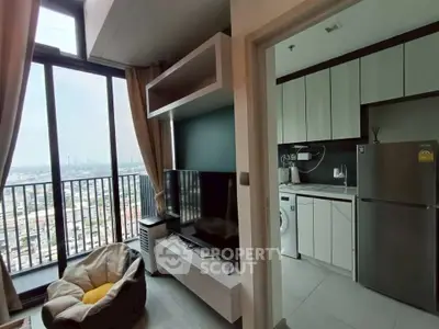 Modern apartment with open kitchen and stunning city view from large windows.