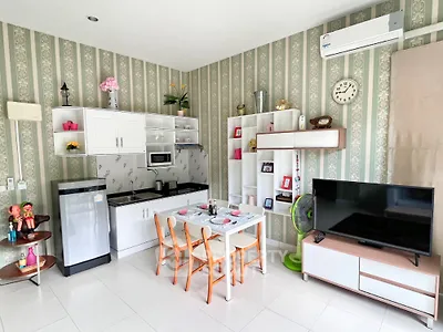 Charming kitchen and living area with modern decor and appliances, perfect for cozy living.
