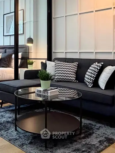 Modern living room with stylish decor and cozy seating area, perfect for relaxation.